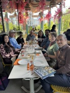 A group of people at a long dinner table